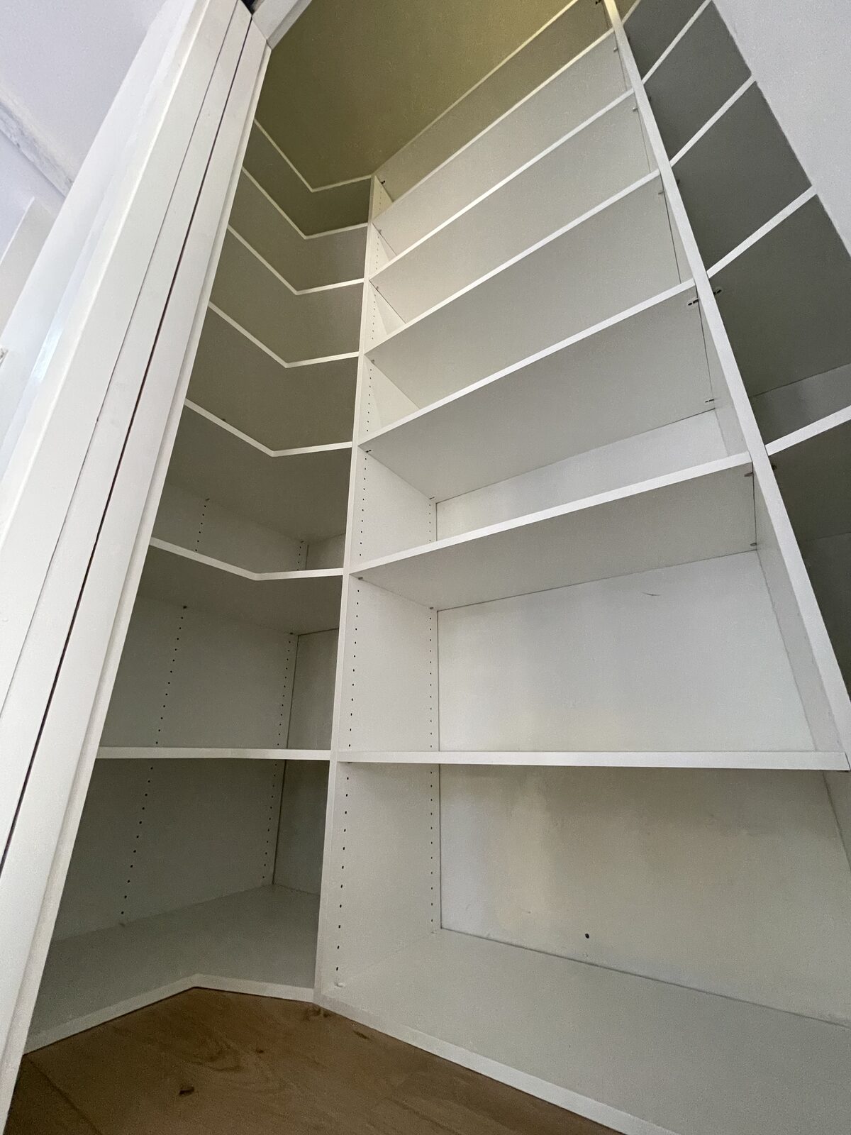 Walk-in closet with floor-to-ceiling custom cabinetry