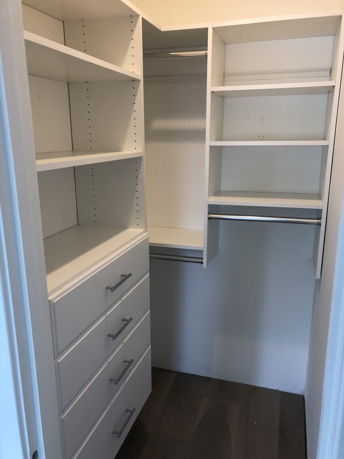 Closet interior with hanging rods and shelf storage