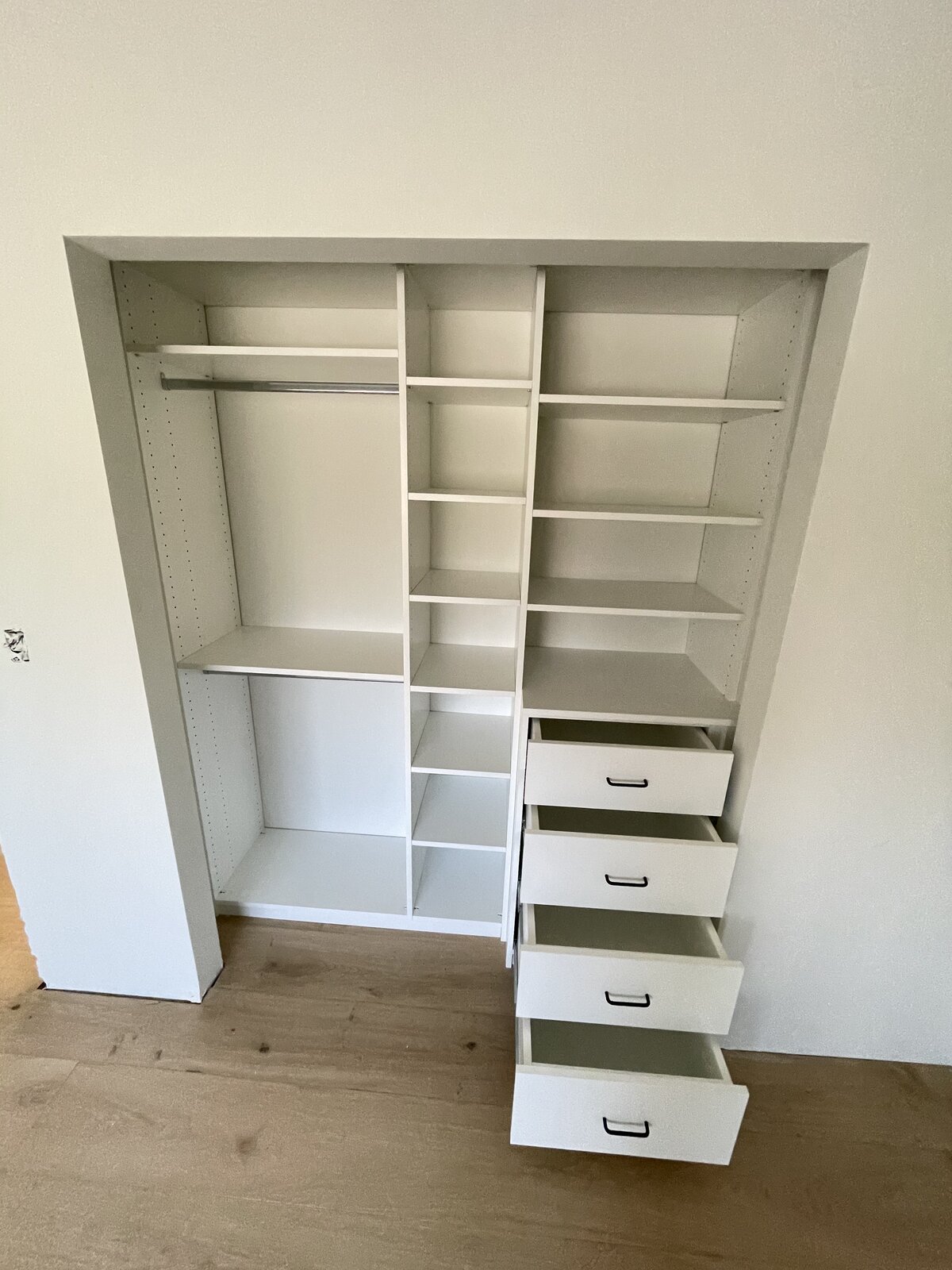 Custom closet build with full-height shelving