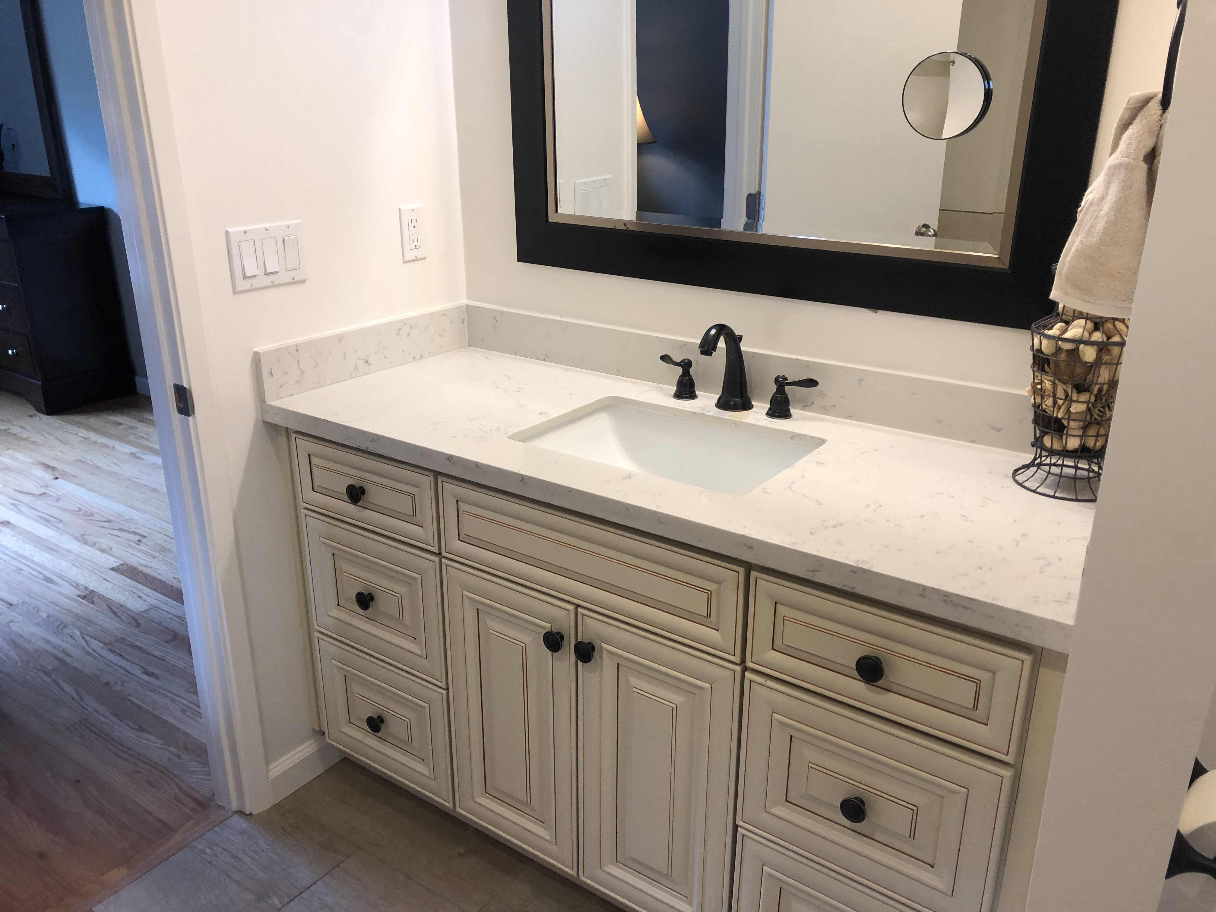 Bathroom remodel with custom cabinetry and stone surfaces