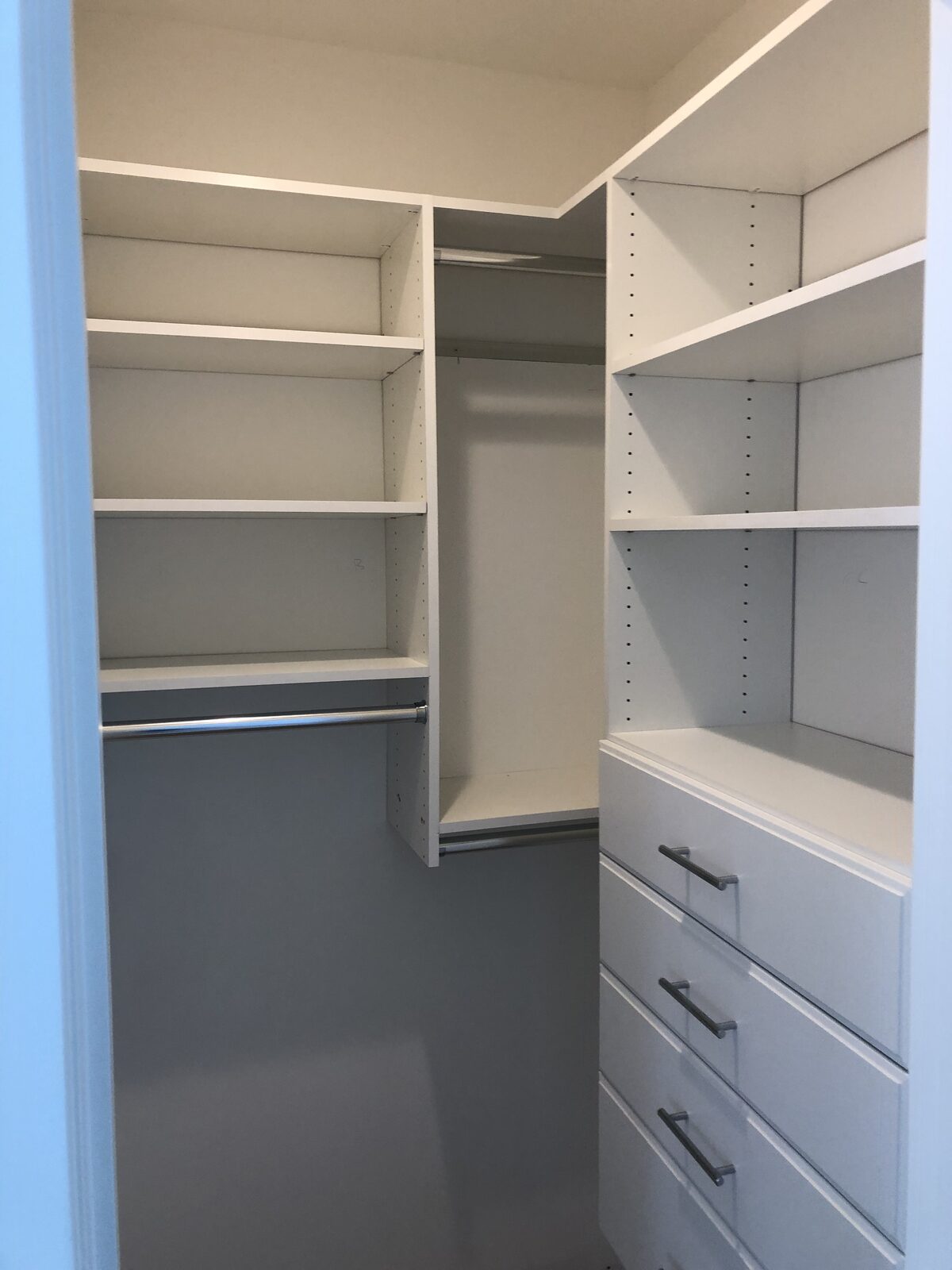 Reach-in closet with custom built-in shelving